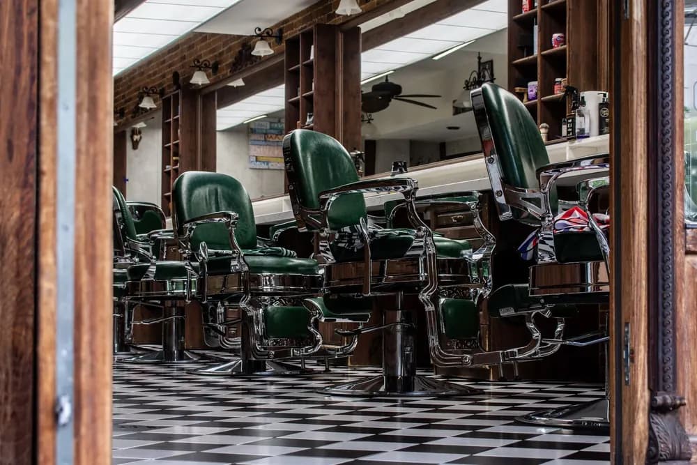 Row of classic green barber chairs