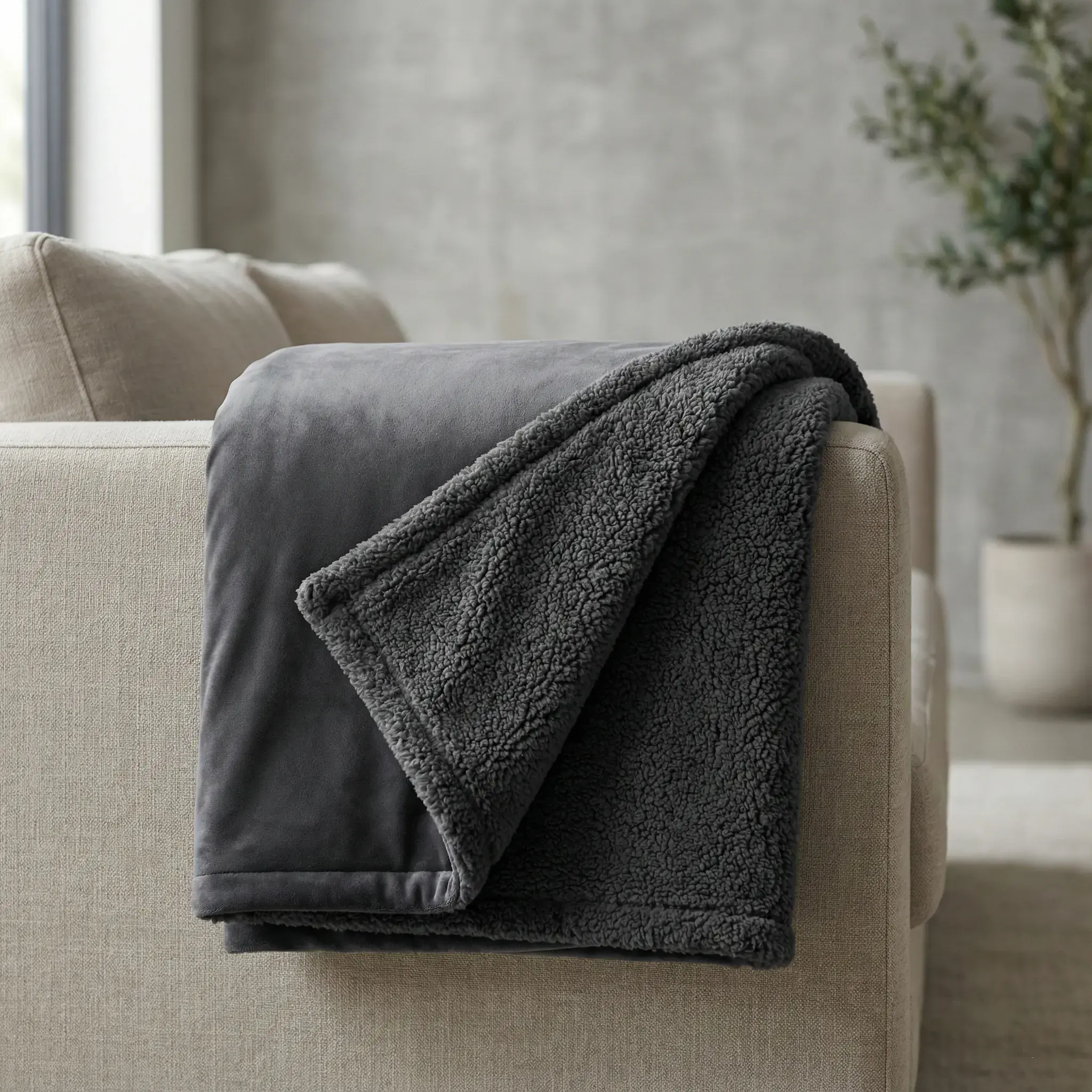 Folded Sanctuary Throw on a sofa